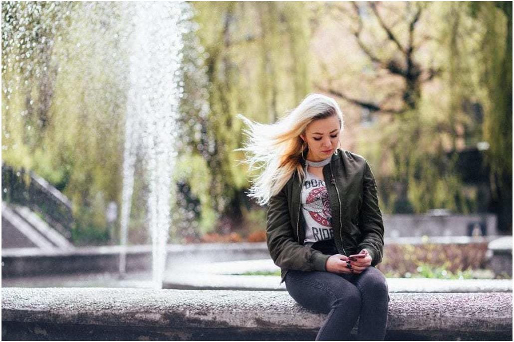 Woman looking up her carrier account number before porting her phone number